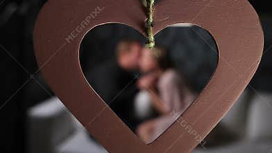 Blurred couple on the sofa in love on Valentines day