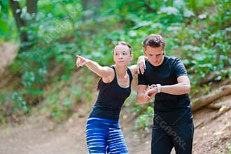Fitness healthy lifestyle of young couples training for marathon run outside in park
