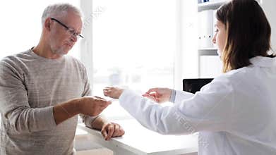 Senior man and doctor meeting at hospital 58