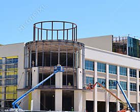 Construction crews work on a new building