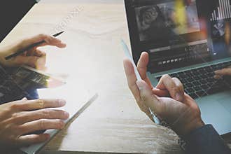 Photo website graphic designer hand meeting team with new project modern studio.Modern laptop digital tablet smart phone on