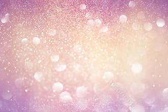 Gold and pink abstract bokeh lights. defocused background.