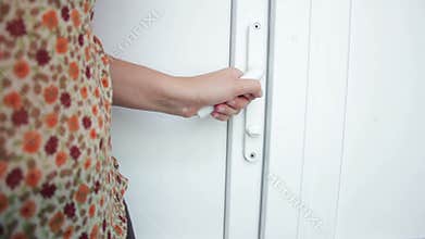 Female hand open doors