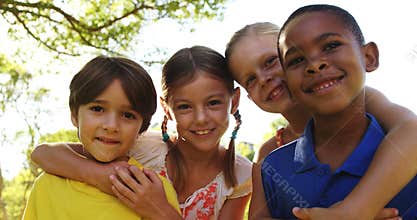 Group of kids standing together with arms around