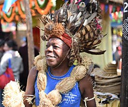 Man in traditional African Tribal dress, enjoying the fair
