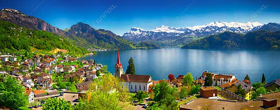 Village Weggis and lake Lucerne surrounded by Swiss Alps