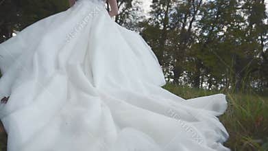 Bride's Wedding Dress on Grass