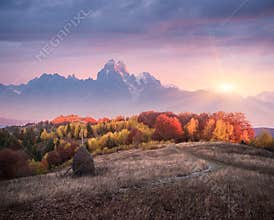 Beautiful autumn landscape in the mountains with the setting sun