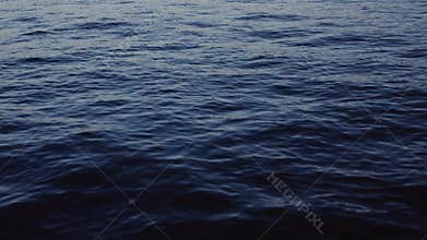 Deep blue sea. Calm waves, slow motion. Natural beauty, water. No people around. Cool atmosphere.