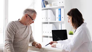 Senior man and doctor meeting at hospital 60