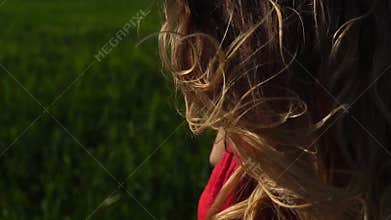 Happy woman enjoying nature beautiful blonde wind in hair. Happy concept.