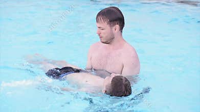 Happy family enjoying in pool