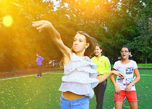 Kids on outdoor sport throwing ball competition