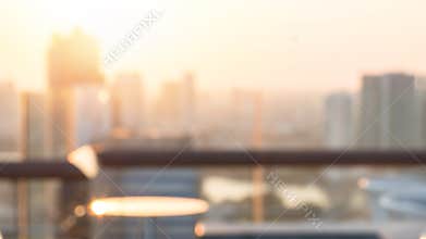 Summer sun blur golden hour sky sunset with city rooftop view  background cityscape office building landscape blurry urban lights