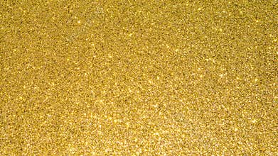 Gold glitter texture background sparkling shiny wrapping paper for Christmas holiday seasonal wallpaper  decoration, greeting