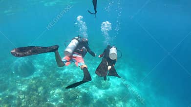 Time lapse of child girl doing a scuba diving course