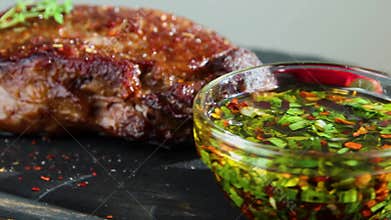 Juicy beef grilled steak, mutton roasted on a cutting board, close up sauce rotation 360 degrees