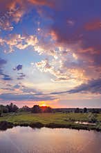 Beautiful sunrise and romantic clouds on the sky.