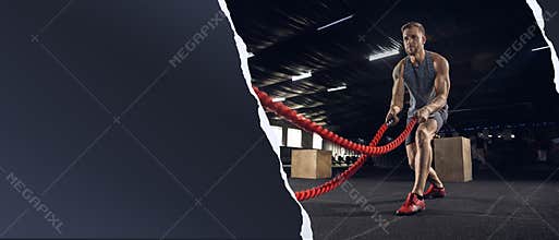 The male athlete training hard in the gym. Fitness and healthy lifestyle concept. Flyer.