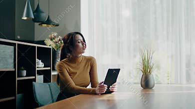 Elegant lady study at home from tablet .