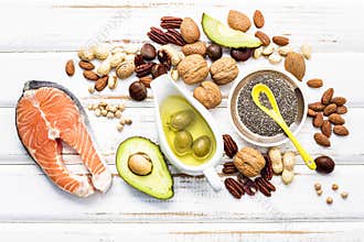 Selection food sources of omega 3 and unsaturated fats. Super foods high vitamin e and dietary fiber for healthy food on wooden