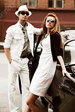 Young couple with a retro car
