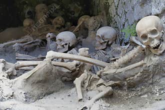 Replica skeletons in the position that the bodies were found after volcanic flow in 79AD Herculaneum