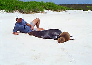 Galapagos sea lion and tourist