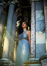 A beautiful princess is looking out of her castle.