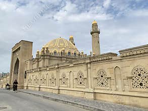 Baku, Azerbaijan, September, 10, 2019. People walking near Tezepir mosque in the fall in Baku