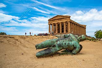 Temple of Concordia and the statue of Fallen Icarus, in the Valley of the Temples, Agrigento, Sicily, Italy