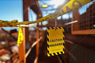 Yellow caution sign/ symbols tag applying on the entry construction workplace to ensure safety warning precaution in place
