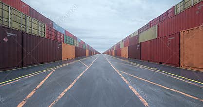 Infinite rows of cargo shipping containers under overcast sky