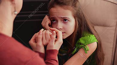 Worried teenage girl receives comfort and hope