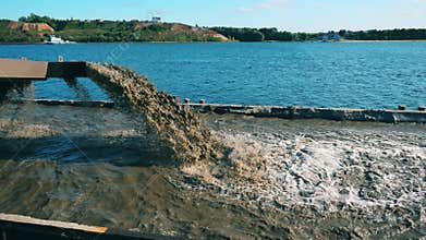Tray of the dredging vessel with dirty water filling it