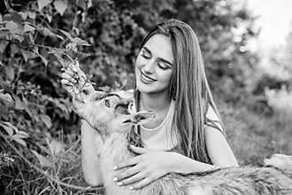 Hello pets. woman vet feeding goat. farm and farming concept. Animals are our friends. happy girl love goat. village