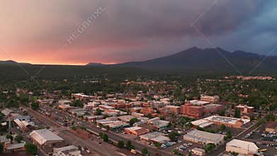 Colorful sunset Flagstaff Arizona city center downtown aerial footage