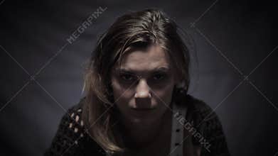 Helpless woman in depression with social problems looking at camera, helping stray