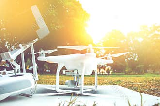 White camera drone standby for take video in tv documentary