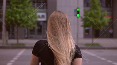Foot passenger crosses the road