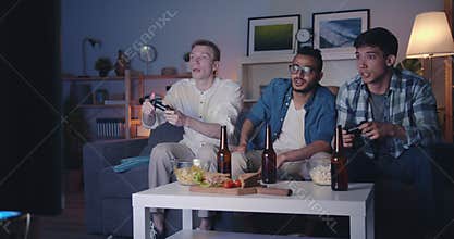 Students multiracial group playing videogame doing high-five in dark flat
