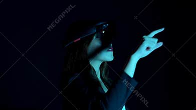 Business woman try vr glasses hololens in the dark room | Portrait of young asian girl experience ar communication | Future