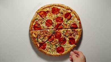 Man Takes A Slice Of Big Pizza From The Wooden Board