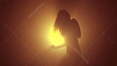 Amazing woman dancing in neon light. Professional dancer sexually moving to the music rhythm. Slow motion.