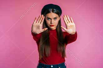 Angry annoyed woman raising hands up to say no stop. distrustful look