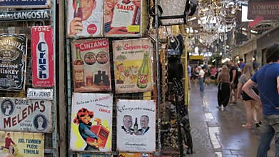 Vintage signs on display in a flea store of San Telmo Fair. Jib down
