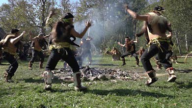 Group Itelmens people dancing ritual dance near fire and scream in traditional clothing indigenous. Itelmens national