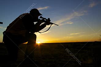 Rifle Hunter in Sunrise
