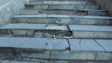 Broken tiles on the stairs