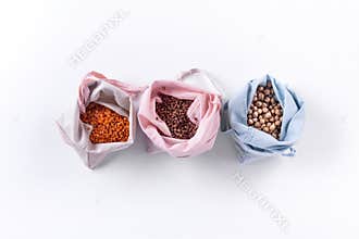 Reusable eco friendly natural cotton produce bags with cereal. Waste packaging. Zero waste food shopping. Plastic free